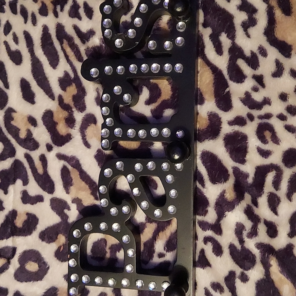 A black F.A.B SharePoint coat hanger.
